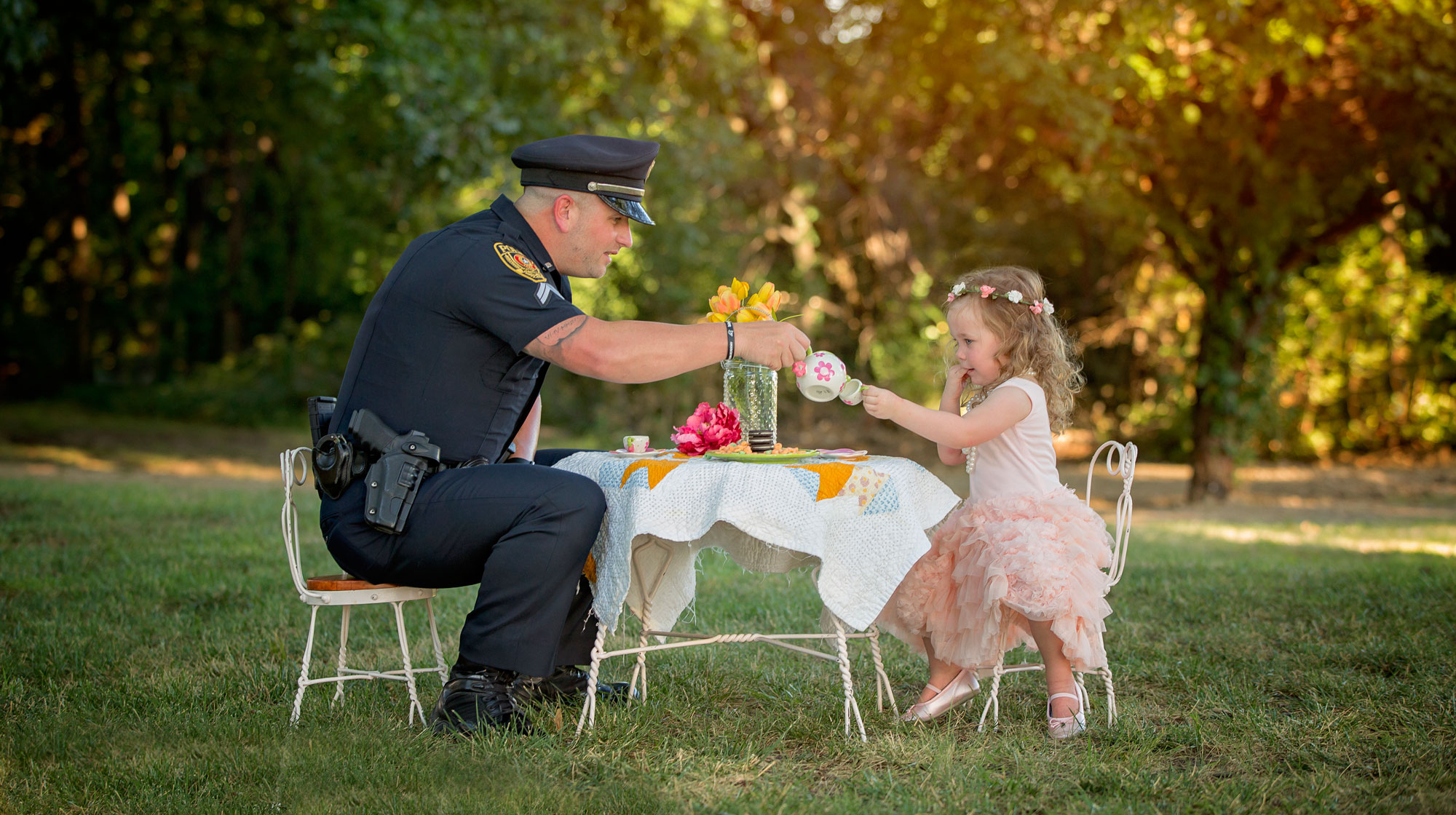little girl has tea party with cop