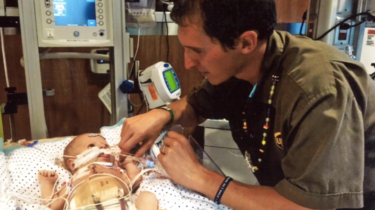 Dad with baby in hospital