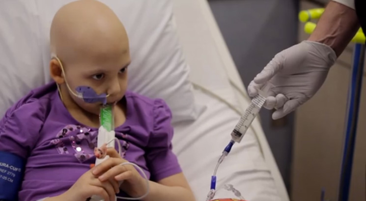 Little girl in hospital sick with cancer