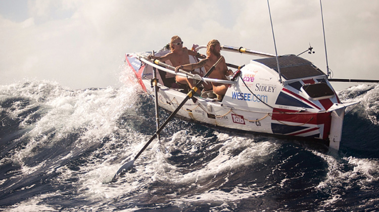 Guys Rowing In High Seas