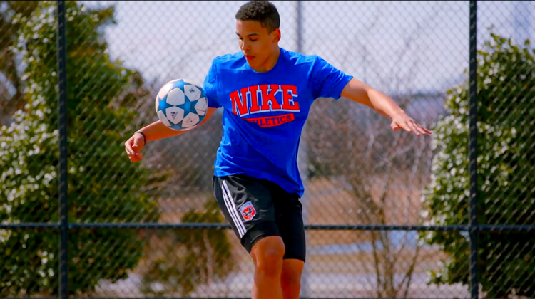 Kid Juggling Soccer Ball