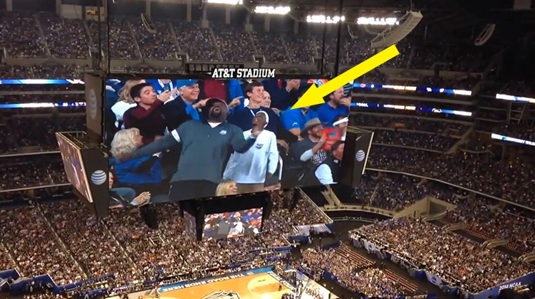 Father son dacning on jumbotron final four