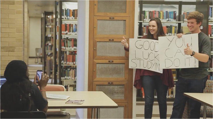 Students holding motivational signs