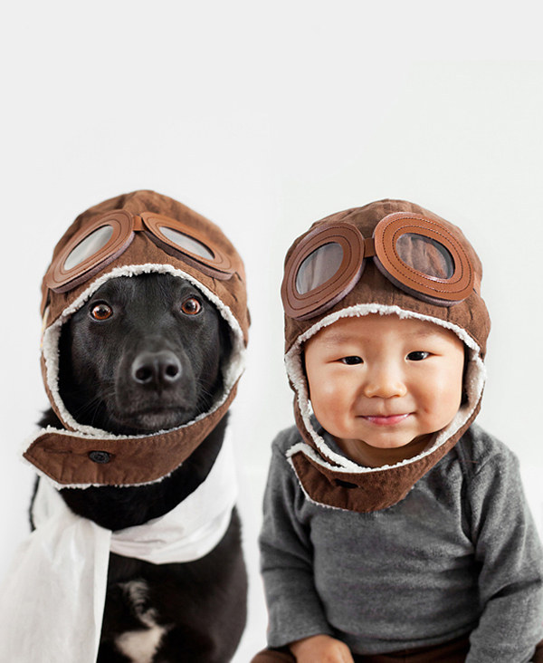 baby and dog dressed as aviators