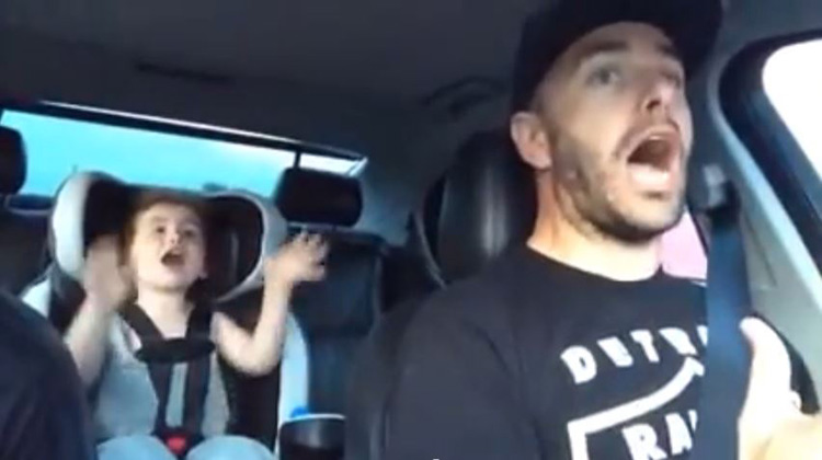 dad and daughter singing in duet