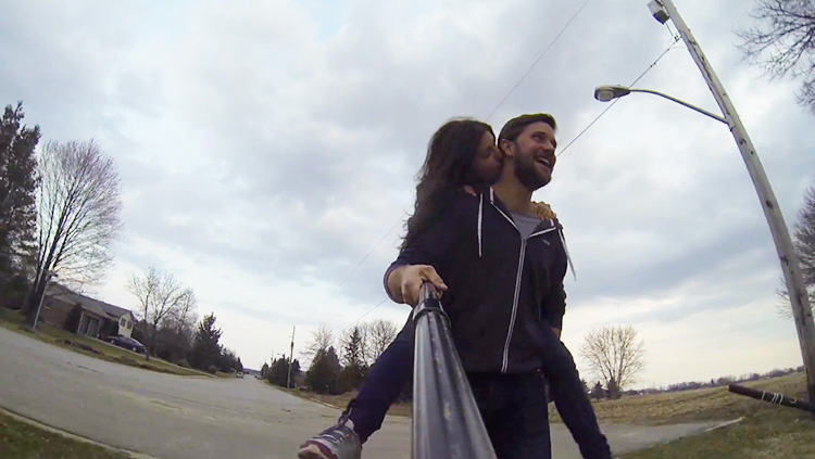 Girl on boyfriends back walking to proposal.