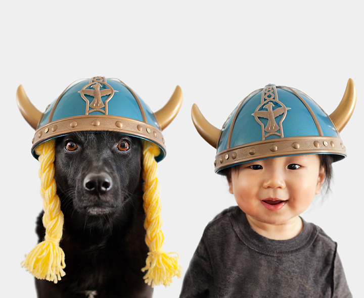 baby and dog wearing old opera singer hats