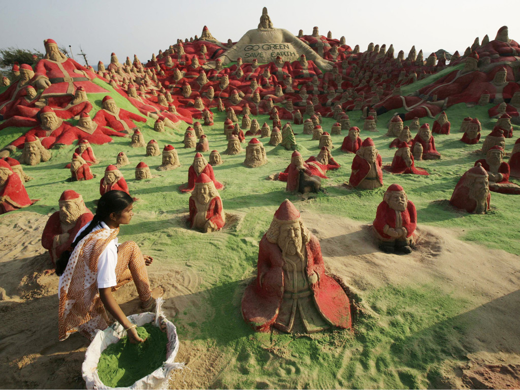 sudarsan sand art institute students santas 500