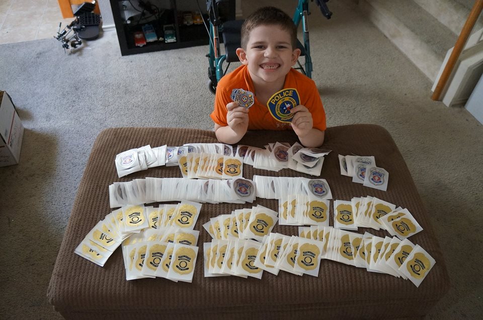 kobin and the donated stickers from police department