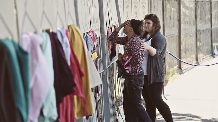 woman crying after being able to own some new clothes that were donated at the street store