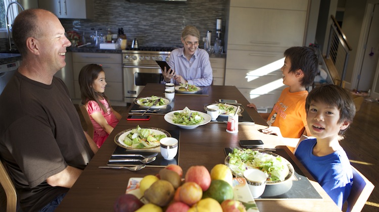 family using transcense at dinner table