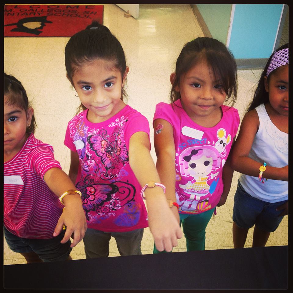 kids wearing pledge cents bracelets
