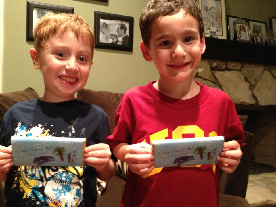dylan and jonah holding chocolate candy bars