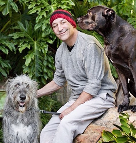 sam simon with two dogs