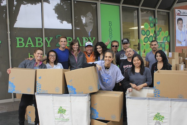 Honest team delivers product to Baby2Baby