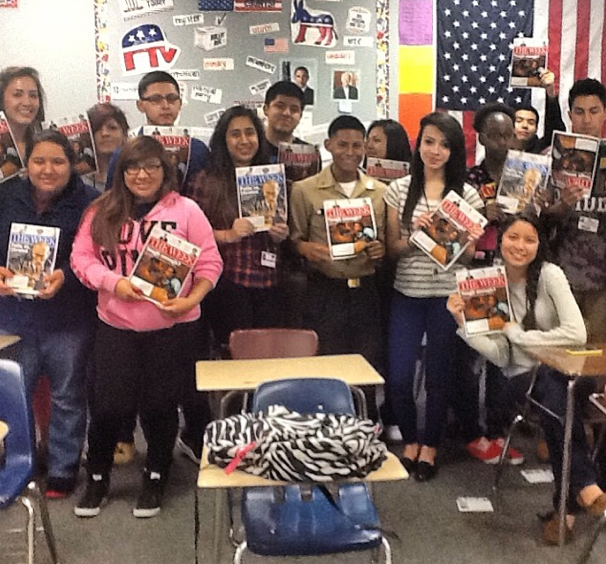 kids with magazines funded by pledgecents campaign