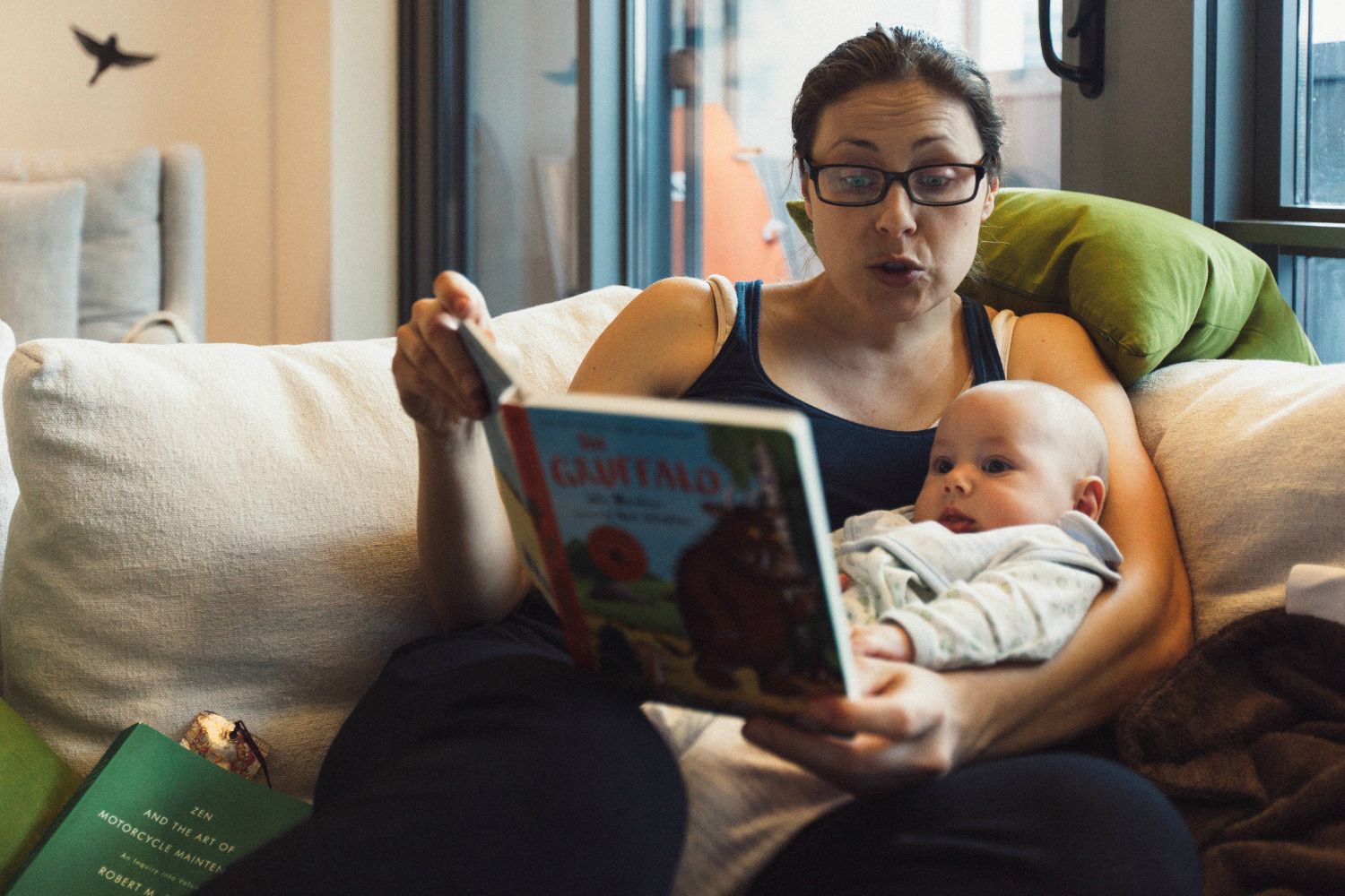 mother reading to baby jacob