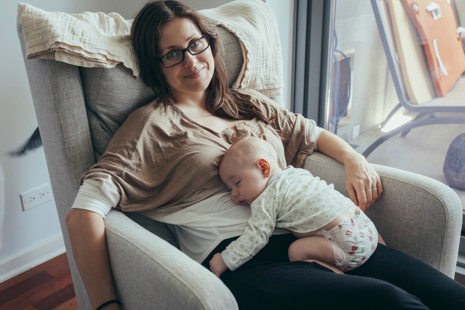 mom with baby sleeping on her belly
