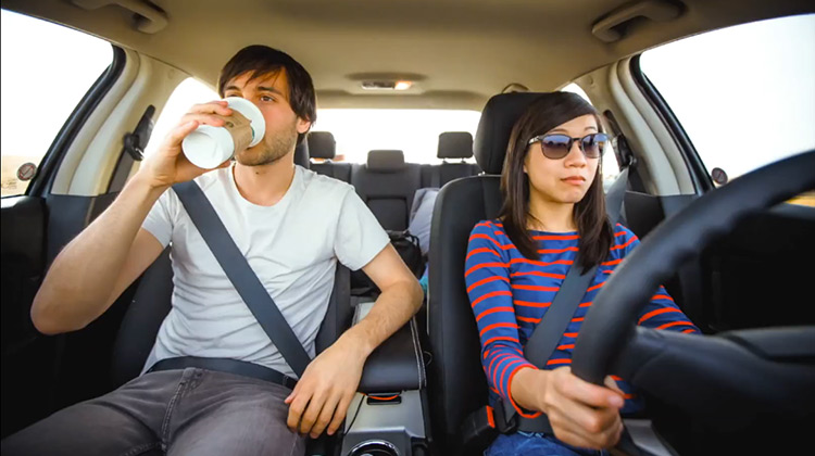 Cute couple in car roadtripping across America