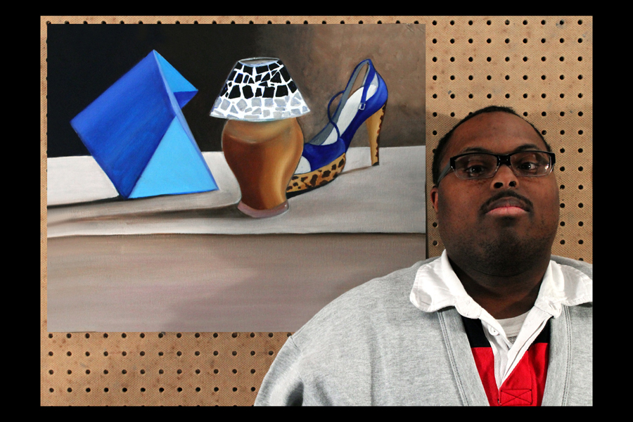 ezra roy next to his painting