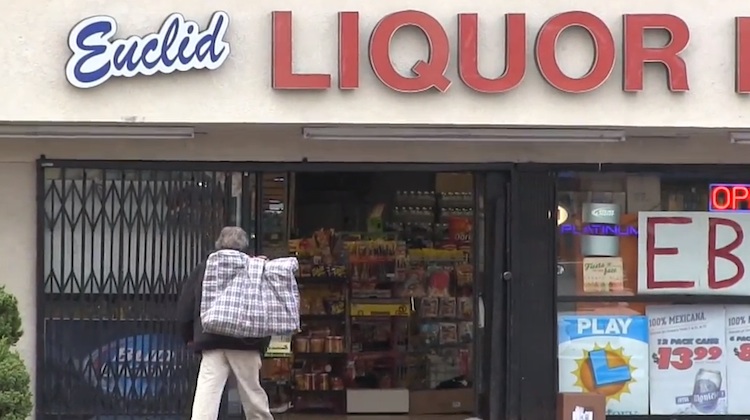 homeless man outside liquor store