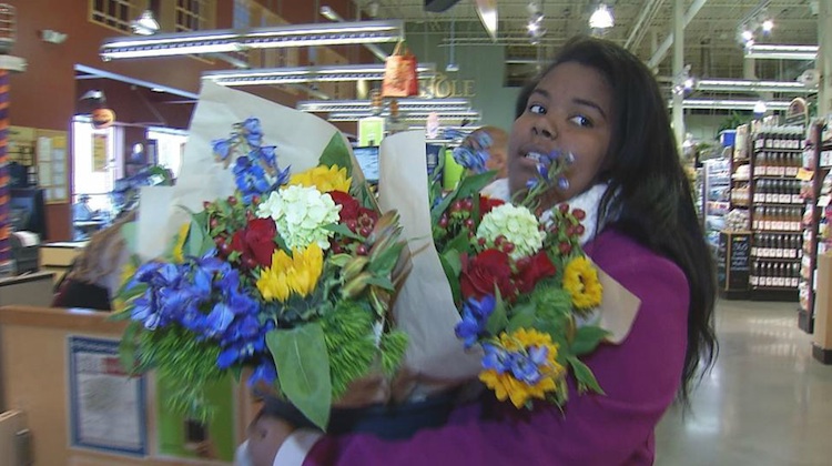 high school senior holding bouquet of flowers