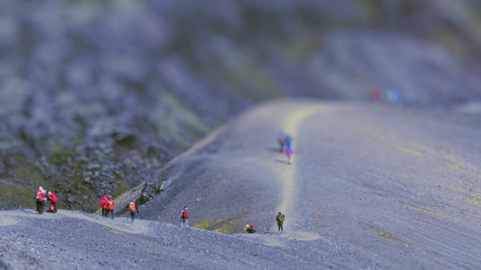 Tilt shift photography of people looking like ants on mountain