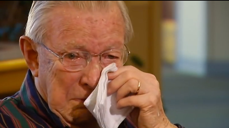 Vet Bill Moore tearing up while reading his long lost love letter from 1945
