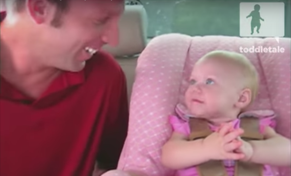 dad and baby laughing