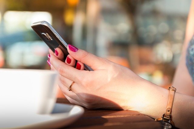 woman holding phone