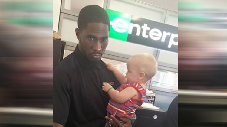 enterprise employee holds mothers baby