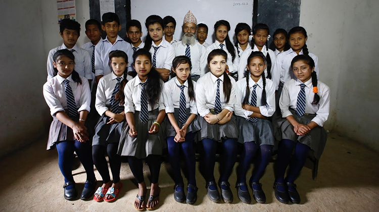 nepalese classroom students 68 year old man