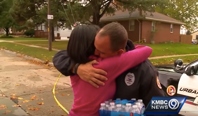 Woman and cop hugging in Iowa