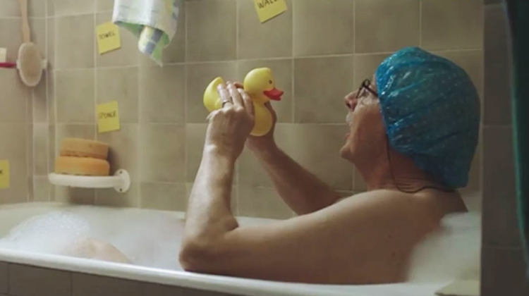 man in bubble bath with sticky notes and rubber duck