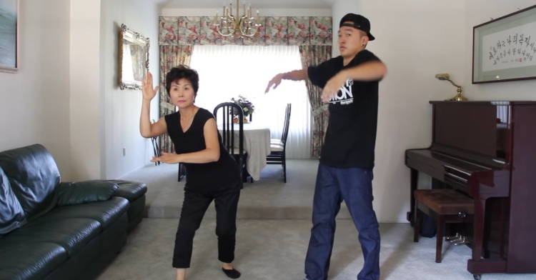 son and mom dancing together