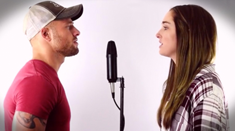 Andrew James & Chandler Gallagher facing each other while singing a cover of "i can't help falling in love with you."