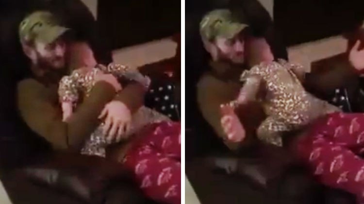 Dad hugging baby