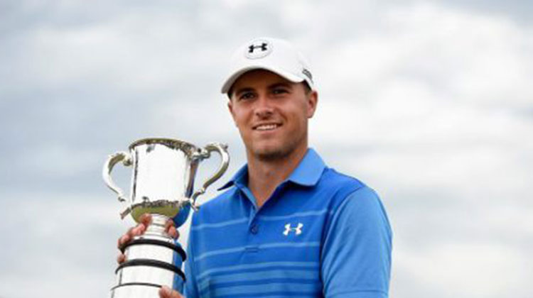 Jordan spieth holding trophy