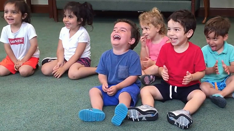 kid laughing in music class