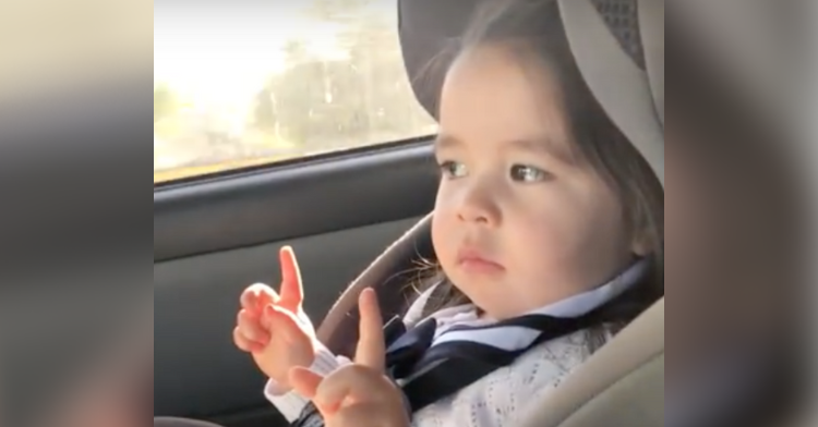 little girl dancing uptown funk in her car seat