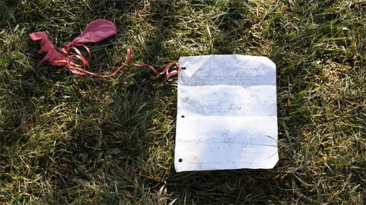 Note attached to balloons