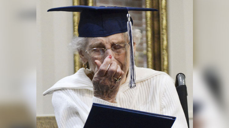 97- year-old cries tears of joy with diploma