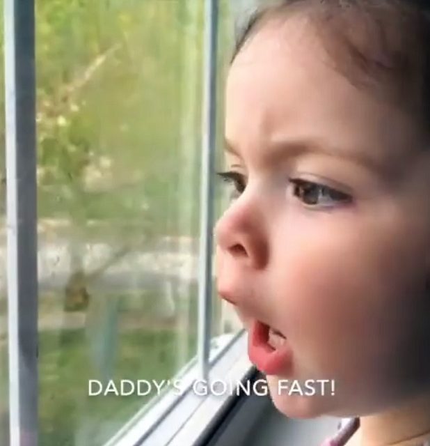Olivia serves as a backseat driver - from inside her house - as her dad heads off to the store to grab some breakfast.