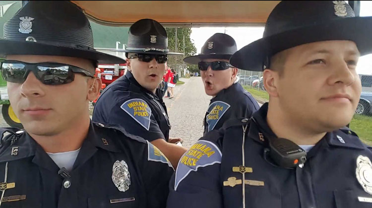 4 state troopers on golf cart