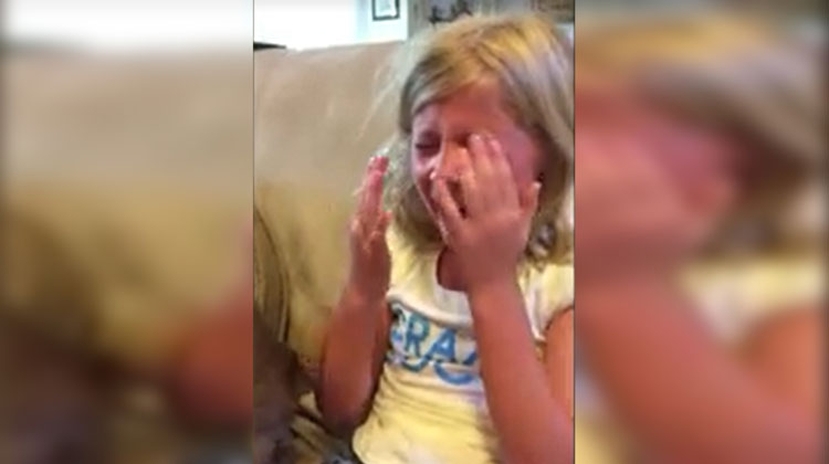 girl sobbing on couch