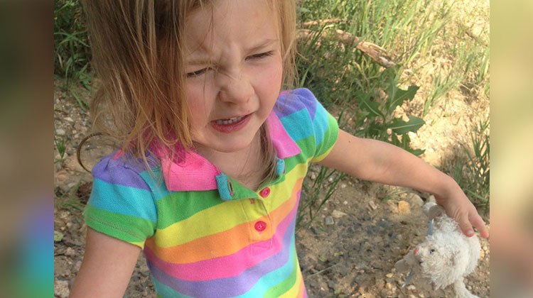 Angry 4 yr old in colorful shirt