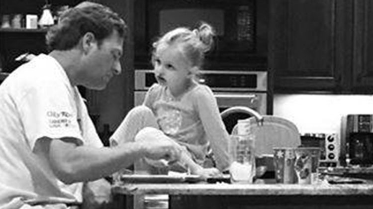 farmer eating dinner with daughter