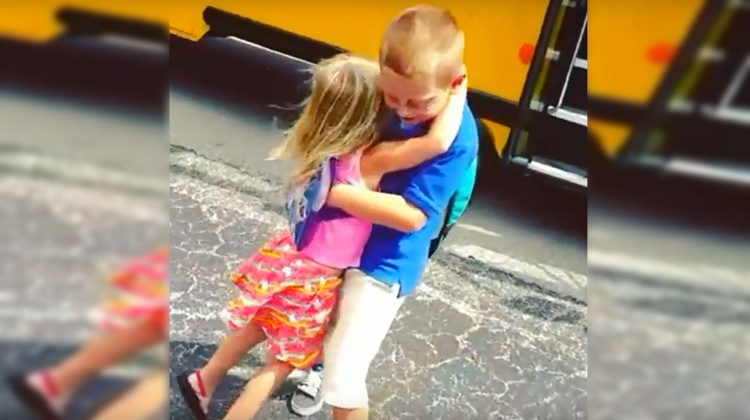 girl hugging big brother