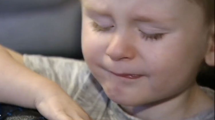 little boy with sad face