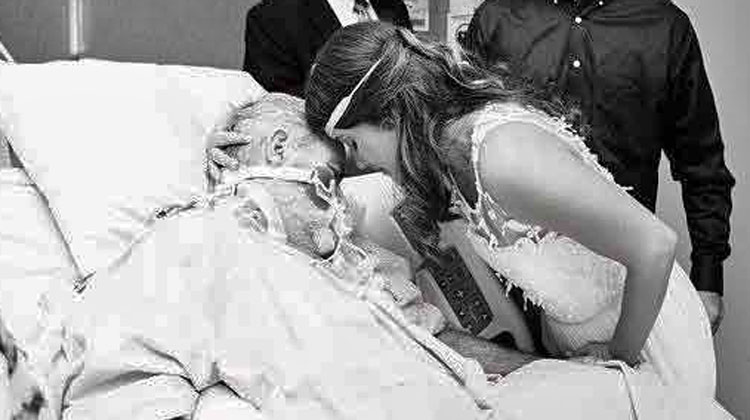 bride bending over dying fathers hospital bed